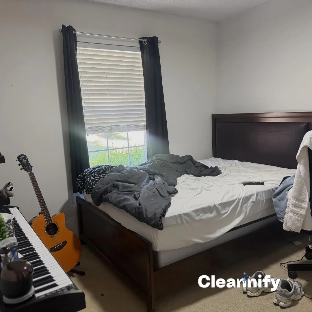 Before residential bedroom cleaning in Charlotte with an unmade bed and cluttered floor