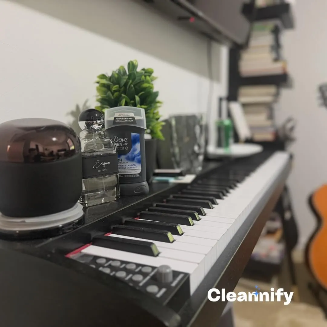 Before dusting a bedroom piano surface during a residential cleaning service