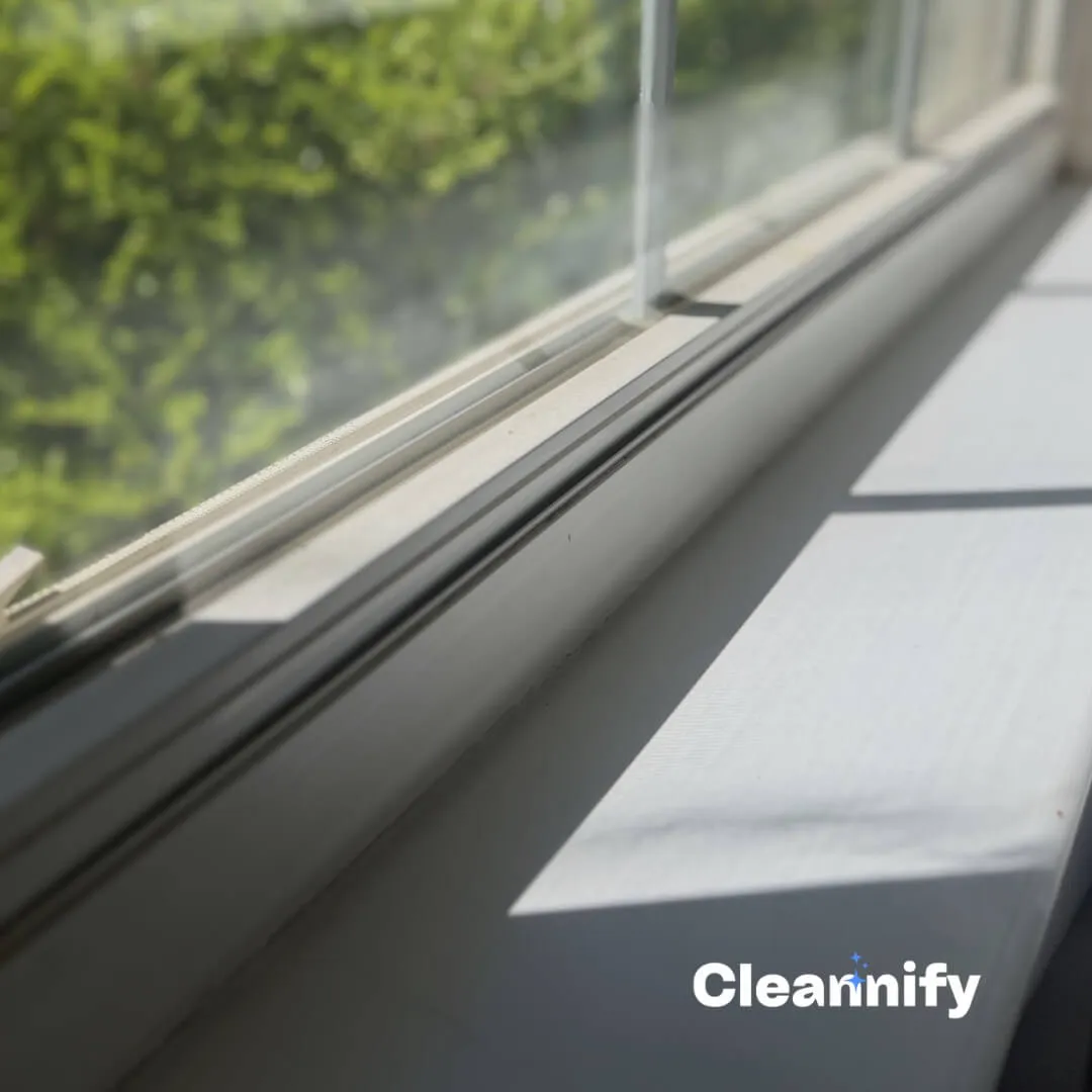 After window sill cleaning in Charlotte showing a cleaner window track